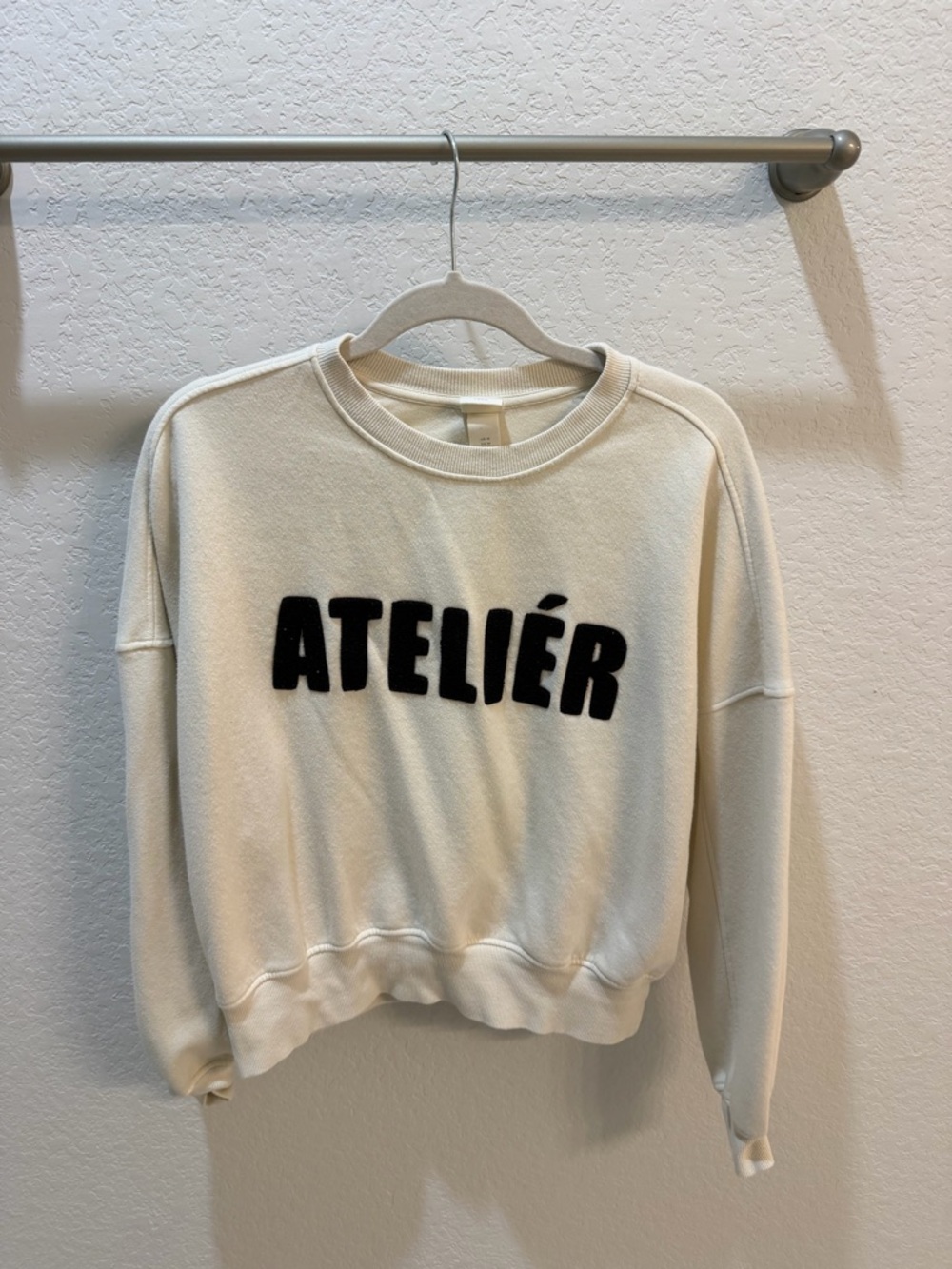H&M Cream Crewneck Sweater with Black ATELIÉR Appliqué